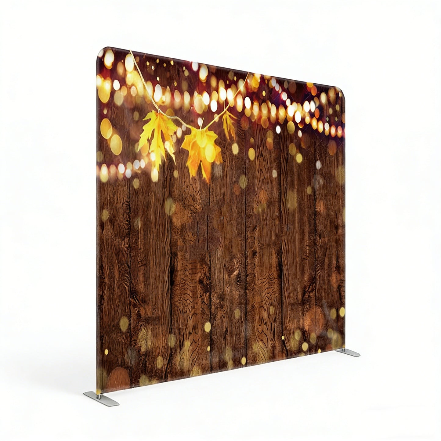 Portable backdrop with wooden texture, autumn leaves, and string lights on a white background